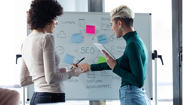 two women sharing seo knowledge